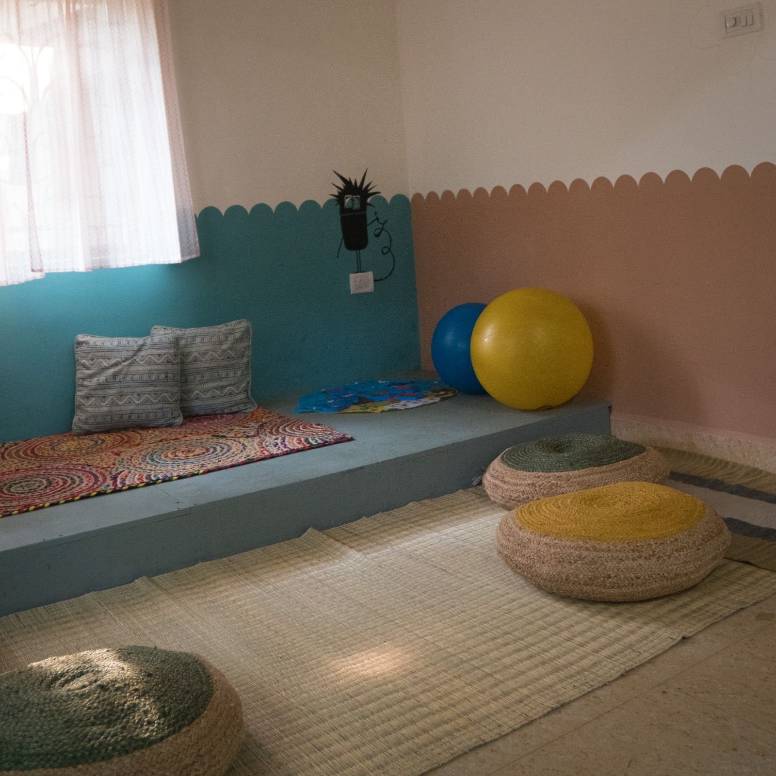 The calm corner at Odo School with floor cushions and play balls